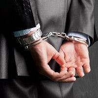 man in handcuffs, embezzlement, crime