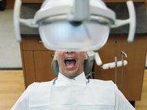 a frightened patient in a dental chair