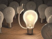 a lightbulb holding up a hand to volunteer an idea