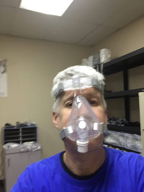 Dr John Flucke wearing a CPAP machine