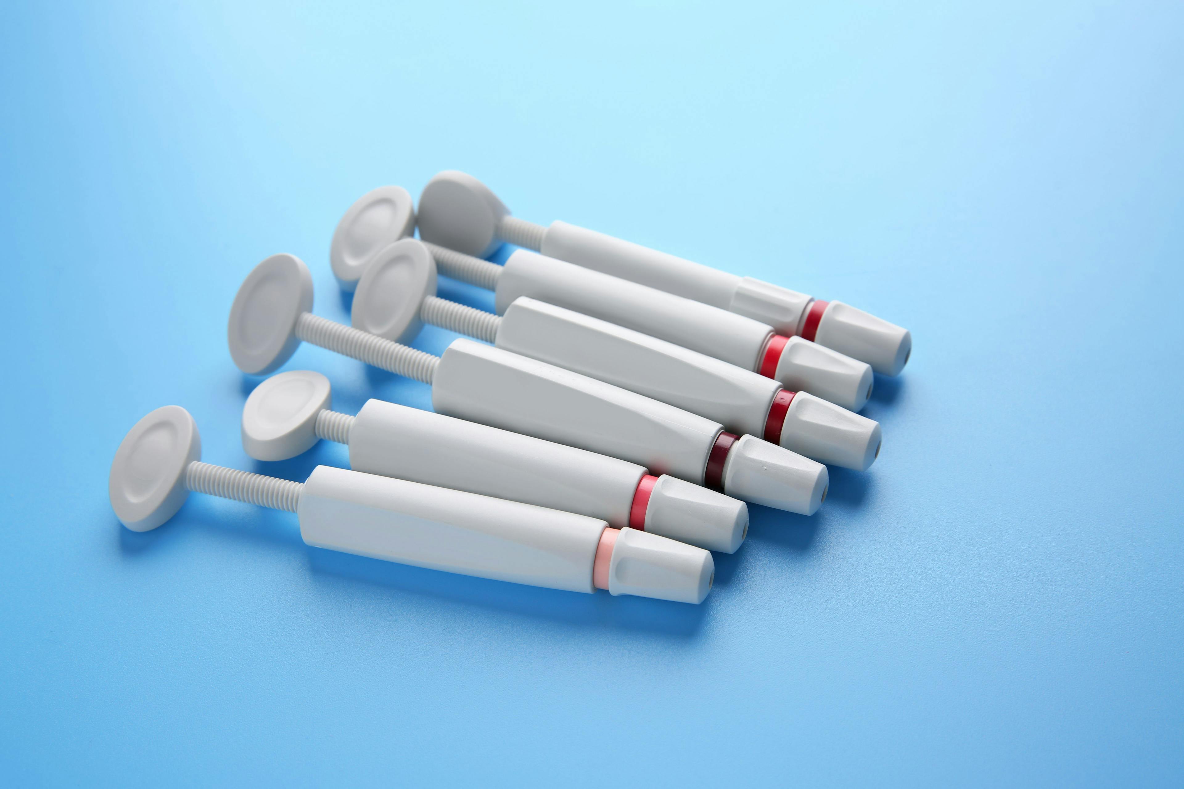Syringes of resin luting cements. 