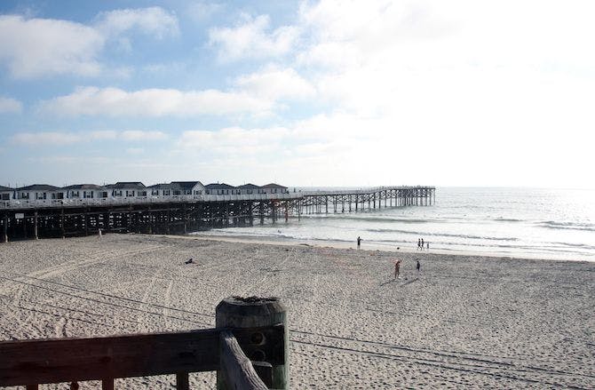 Scenic beach with a wooden pier