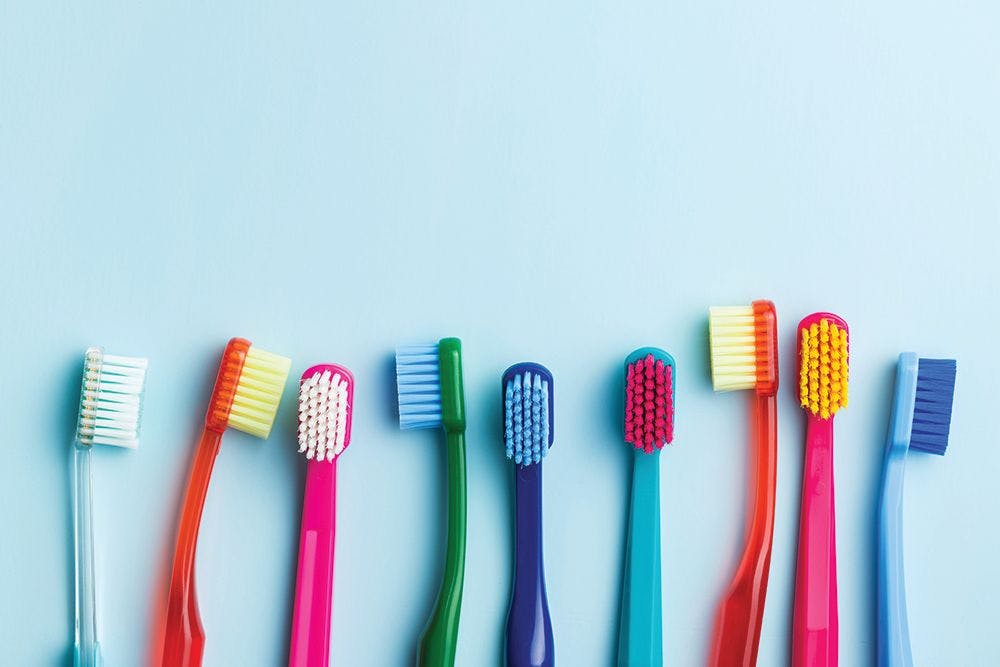 Image of different colored toothbrushes.  Jiri Hera / stock.adobe.com