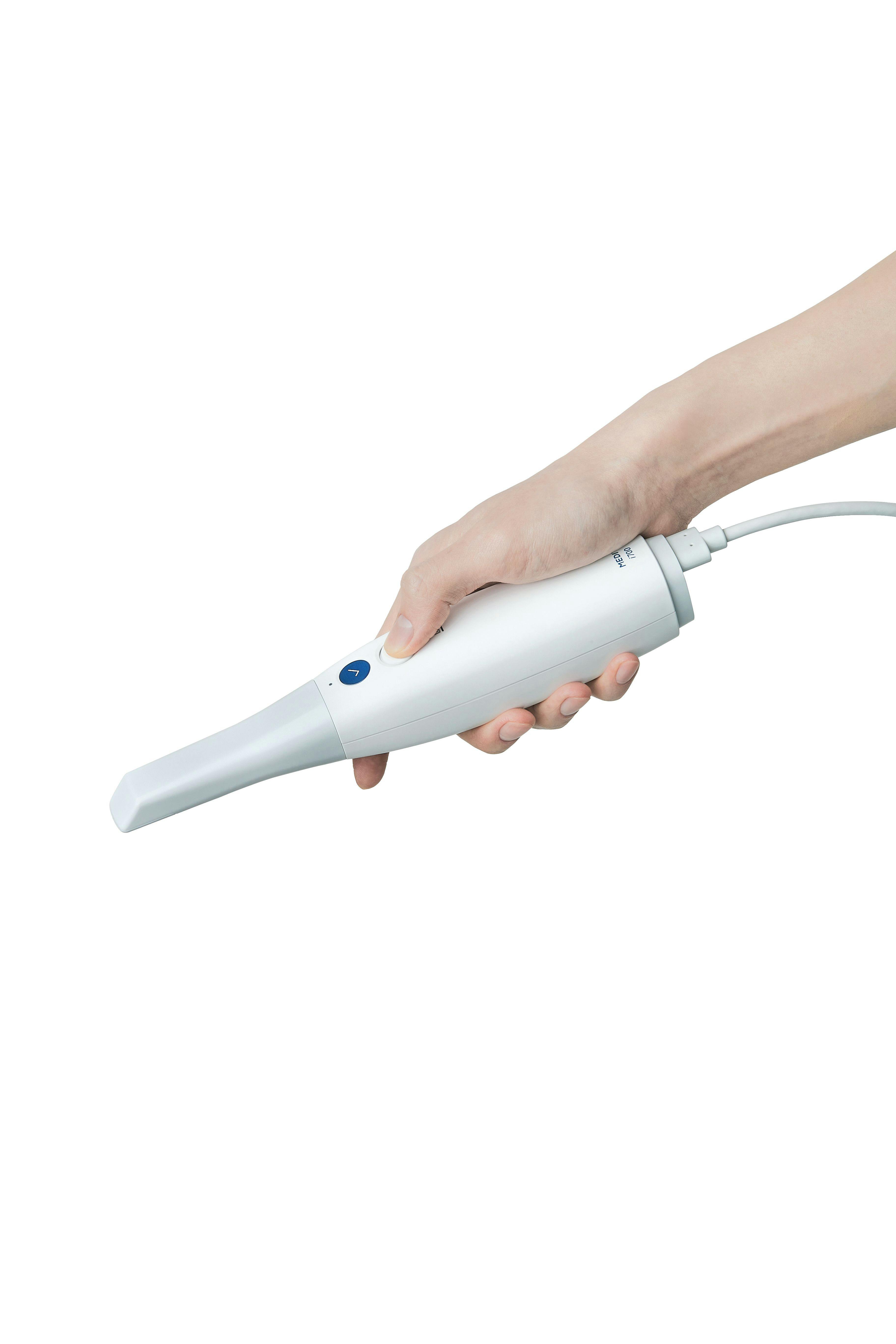 An image of someone holding the Medit i700 intraoral scanner