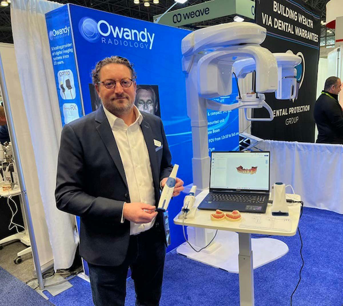 Owandy Radiology's VP of Sales and Marketing Boris Loyez shows off the new Owandy-IOS intraoral scanner Sunday at tjhe GNYDM. | Image Credit: © Stan Goff 